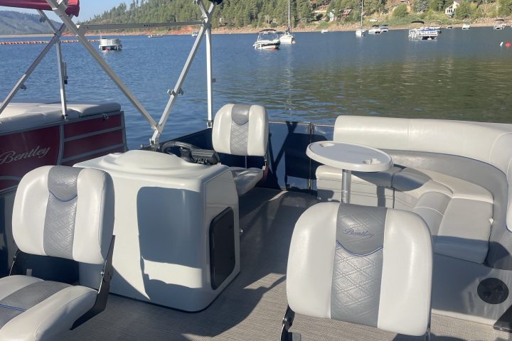 a boat sitting next to a body of water