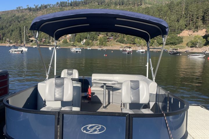 a boat is docked next to a body of water