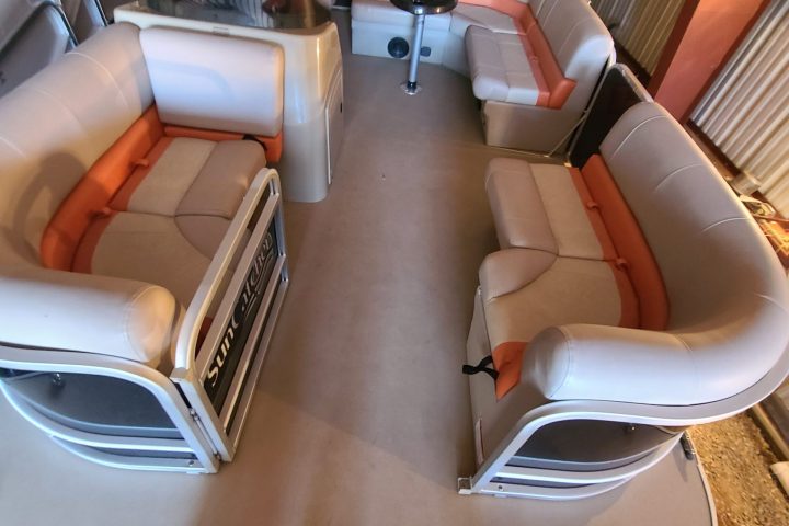 a room with a couch a table and chairs